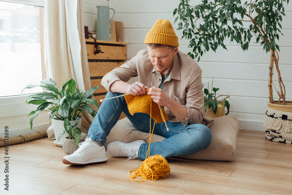 man knitting