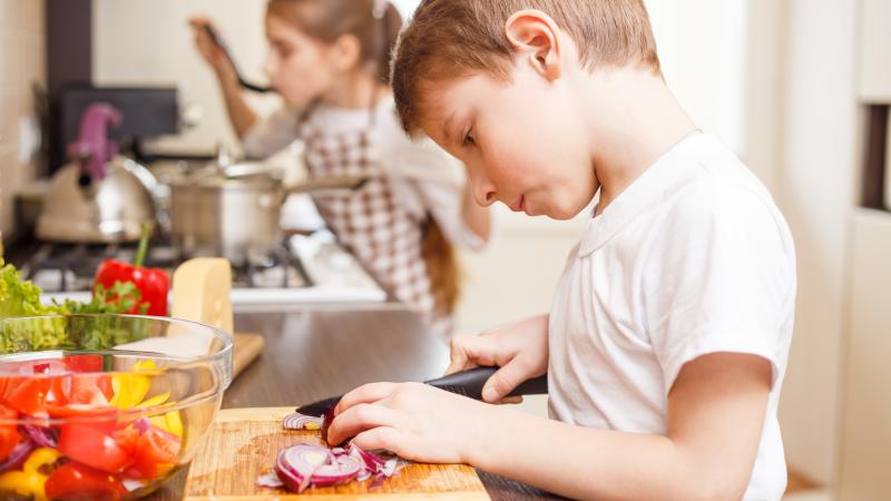 boy cutting onions